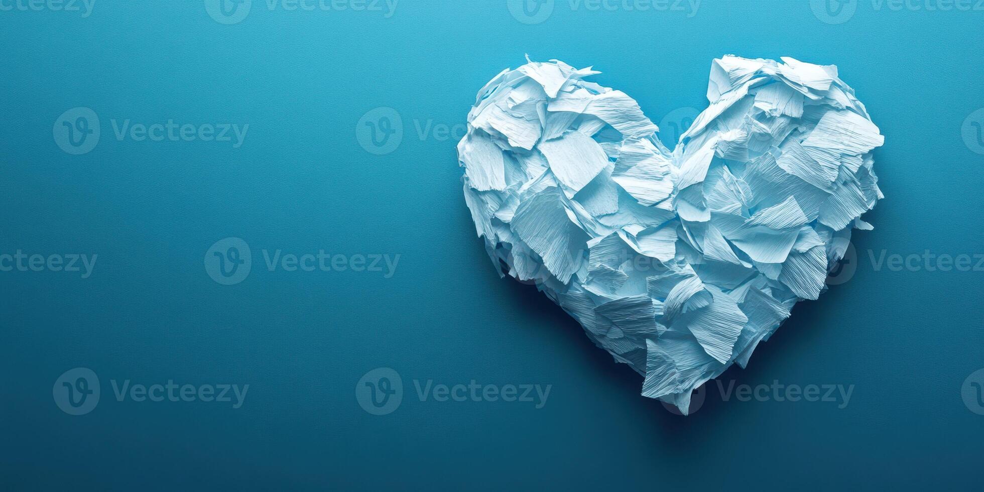 Heart made of crumpled paper on a blue background symbolizes creativity and love for art photo