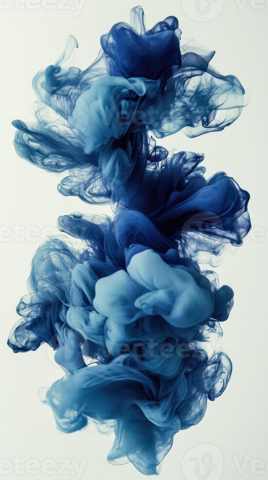 Blue smoke swirls create an artistic pattern in a minimalist style on a light background photo
