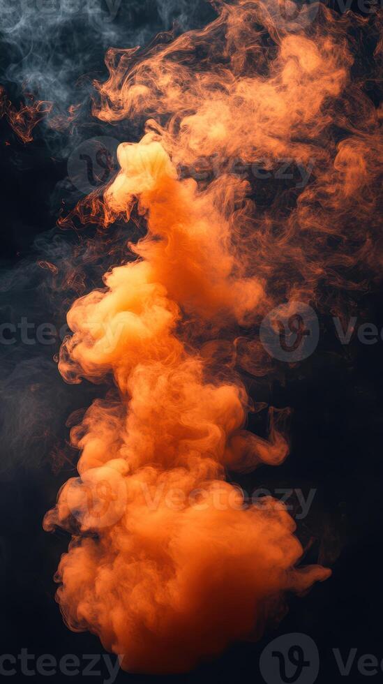 Colorful orange smoke rising gracefully in a dark setting, creating a striking visual display photo