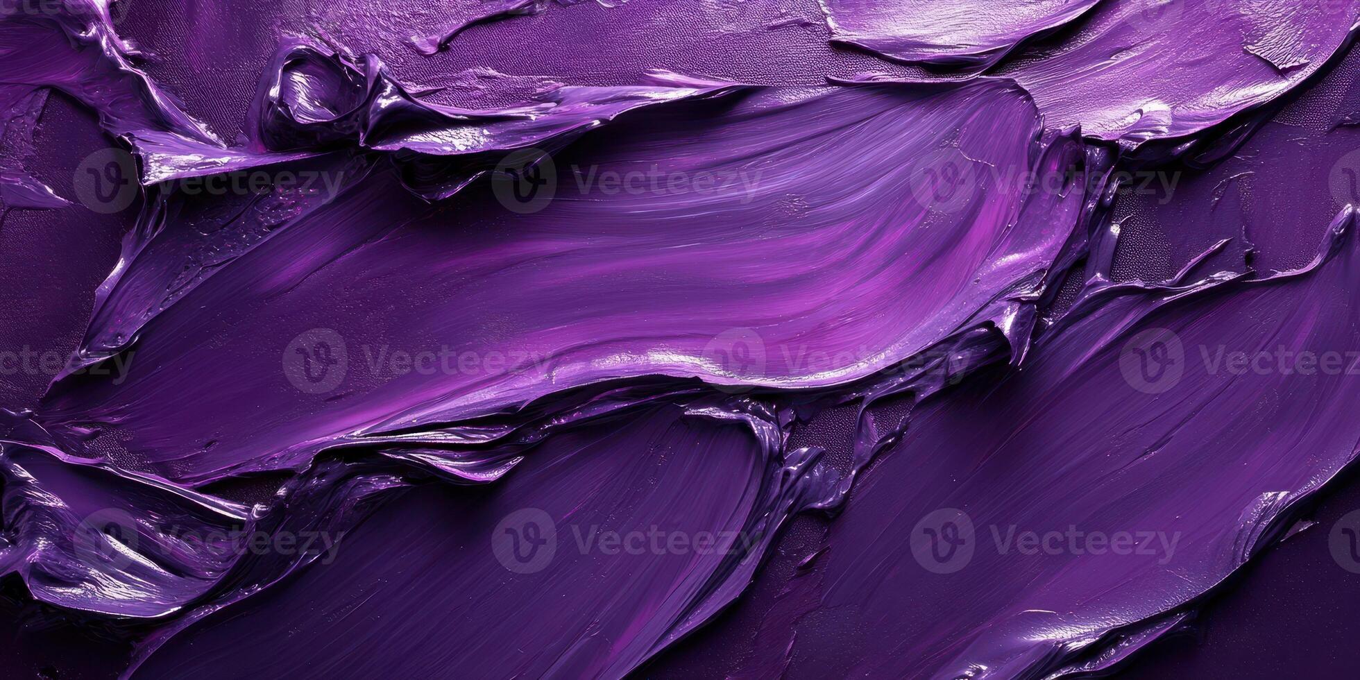 Vibrant purple paint swirls creating a textured abstract composition in a studio setting photo