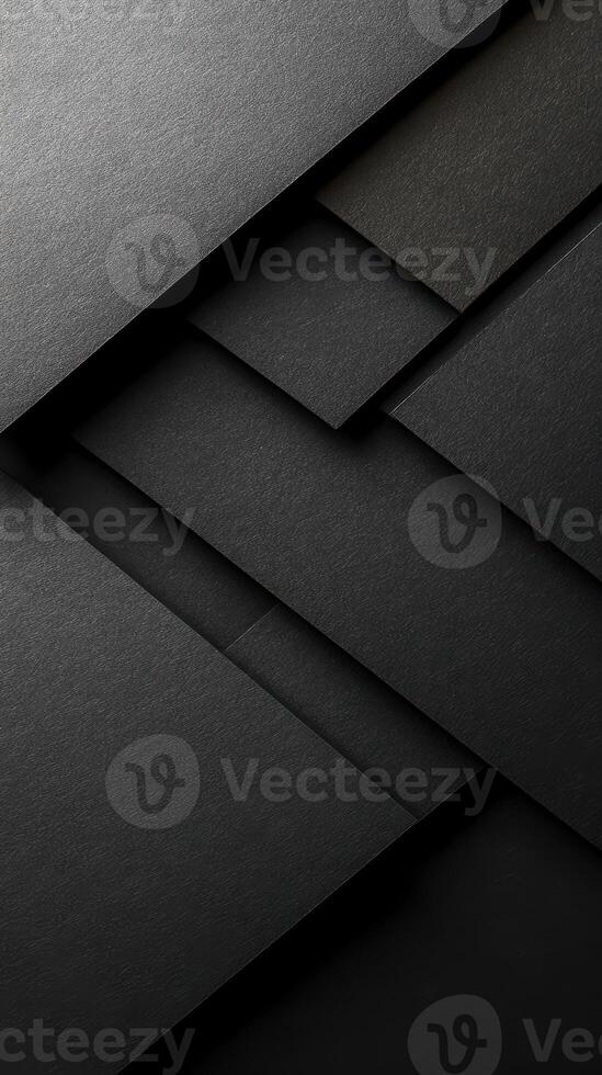 Textured layers of black paper create a modern abstract design ideal for backgrounds or art projects photo