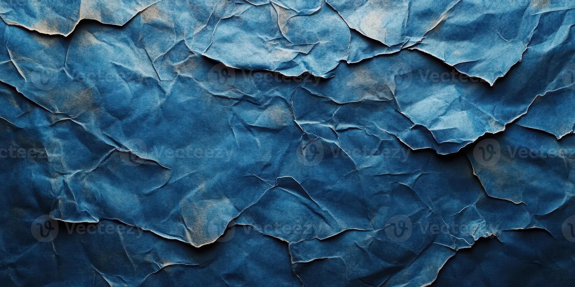 Crumpled blue paper texture reveals depth and contrast suitable for artistic backgrounds or design projects photo