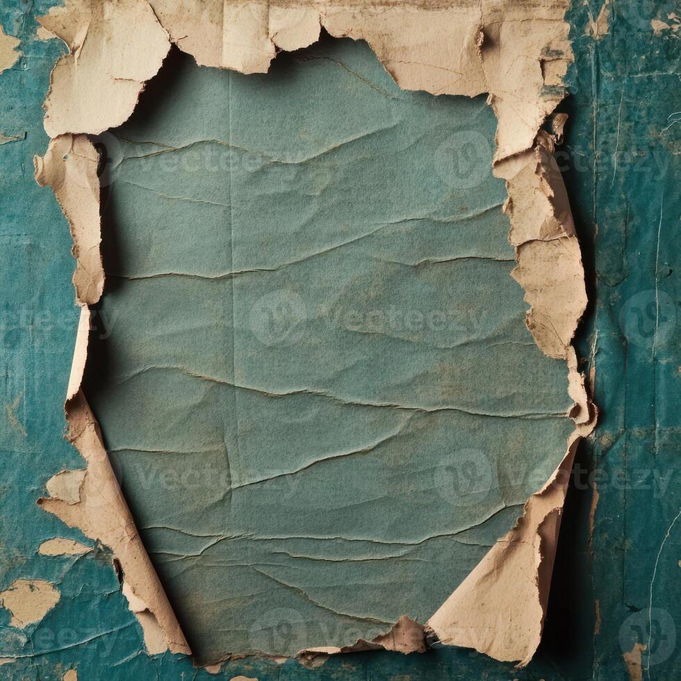 Torn paper revealing textured background in unique artistic display showing natural wear and tear photo