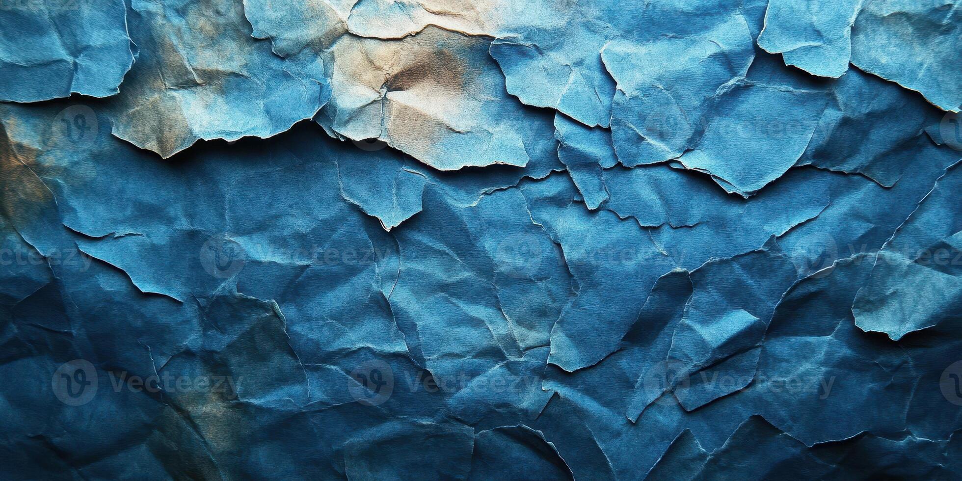 Crumpled blue paper with textured surface suggesting depth and character in artistic design photo