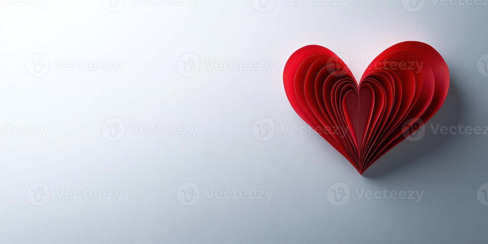 Red paper heart crafted with detail against a light backdrop, symbolizing love and affection for various occasions and celebrations photo