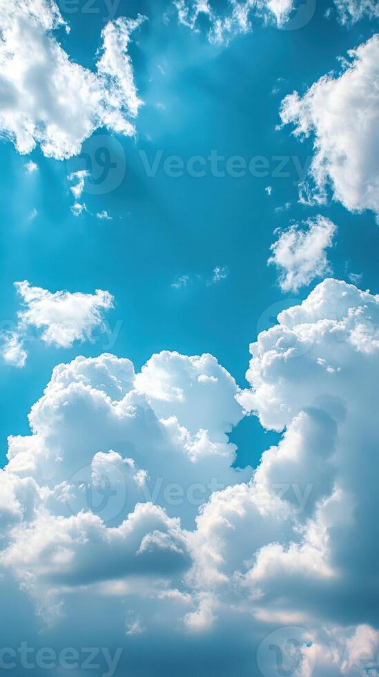 Serene blue sky adorned with fluffy white clouds during a sunny day photo
