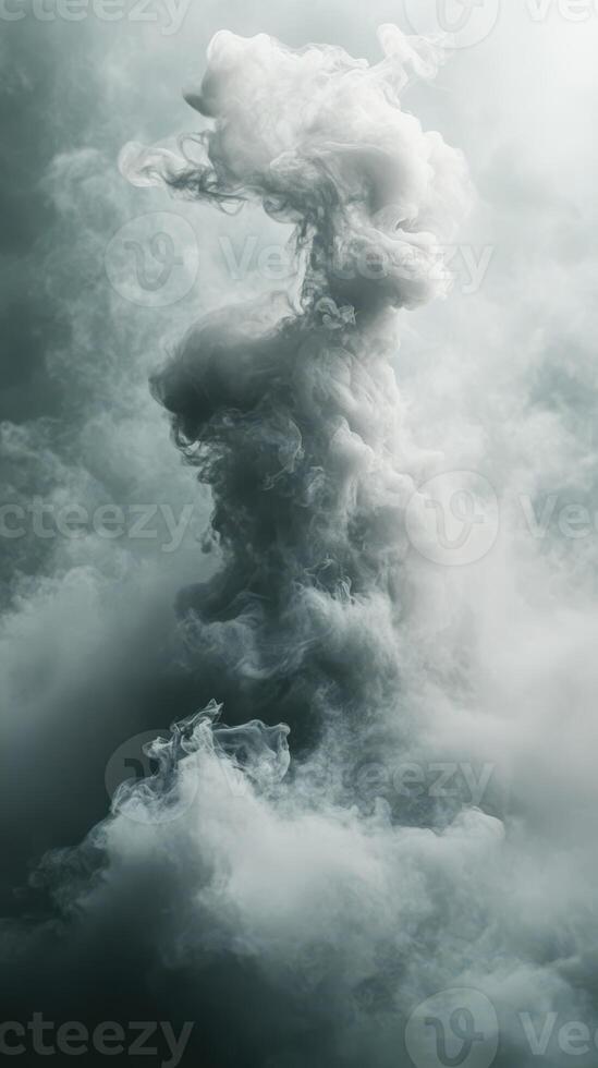 Mysterious formation of swirling mist rises dramatically against a soft, muted background photo