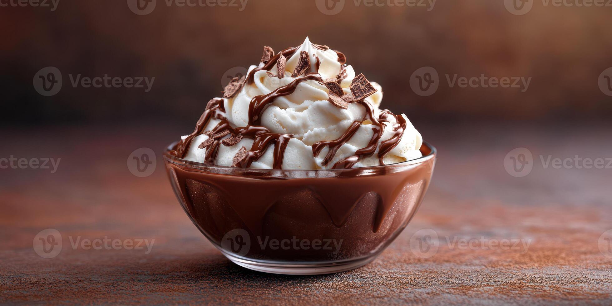 Dessert bowl filled with chocolate mousse topped with whipped cream and chocolate drizzle photo