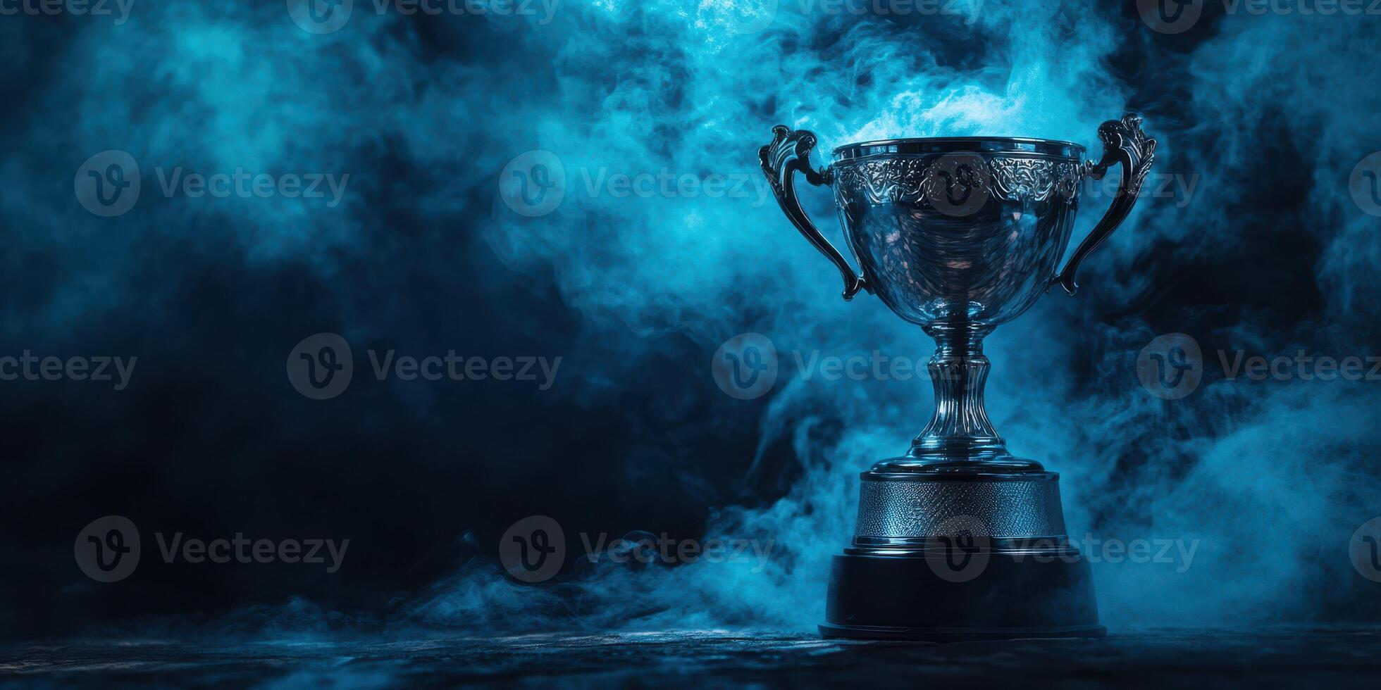 Shiny trophy surrounded by blue smoke on a dark background creates a dramatic and celebratory atmosphere photo