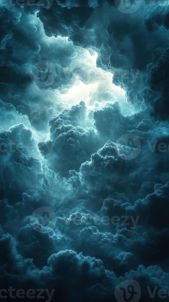 Dramatic thunderstorm clouds illuminated by a hidden light in the sky creating an intense atmosphere photo