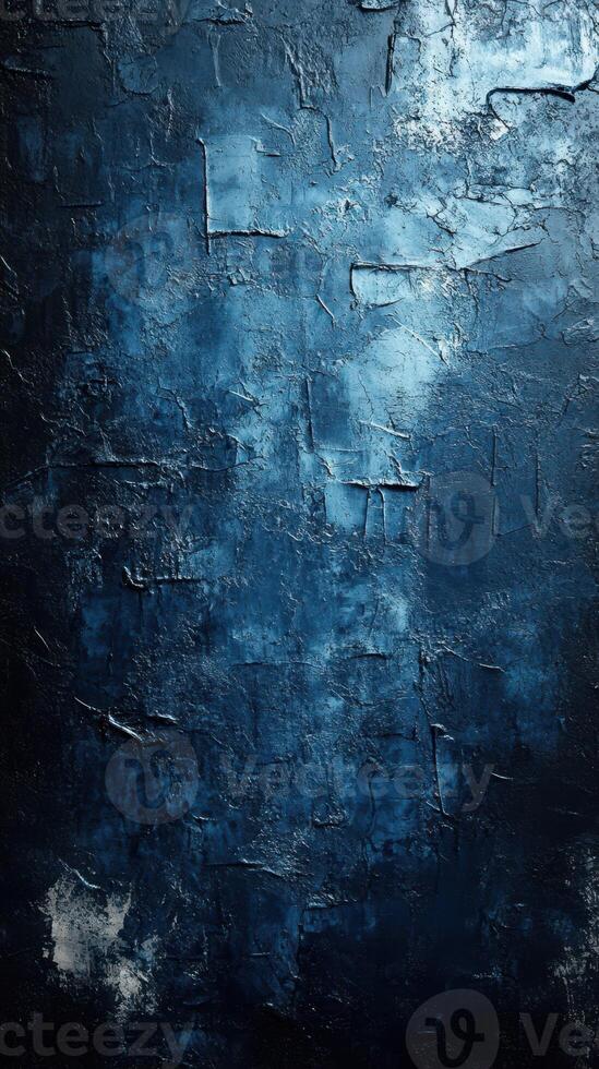 Textured dark blue wall with dramatic lighting showcasing abstract patterns and shades at an indoor location photo