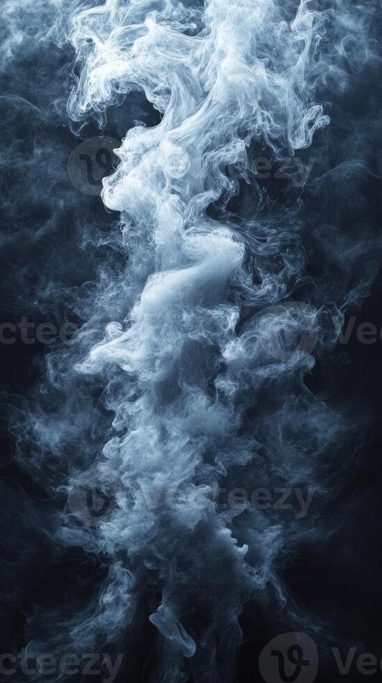 Mystical swirling smoke against a dark background creates an ethereal atmosphere perfect for artistic exploration photo