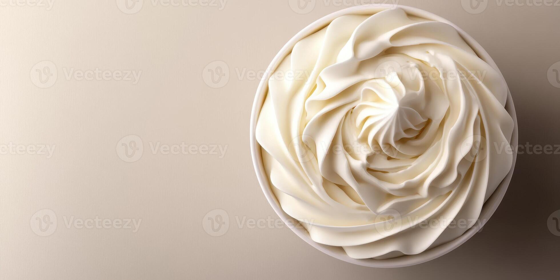 Beautifully swirled whipped cream in a bowl showcasing intricate patterns and smooth textures photo