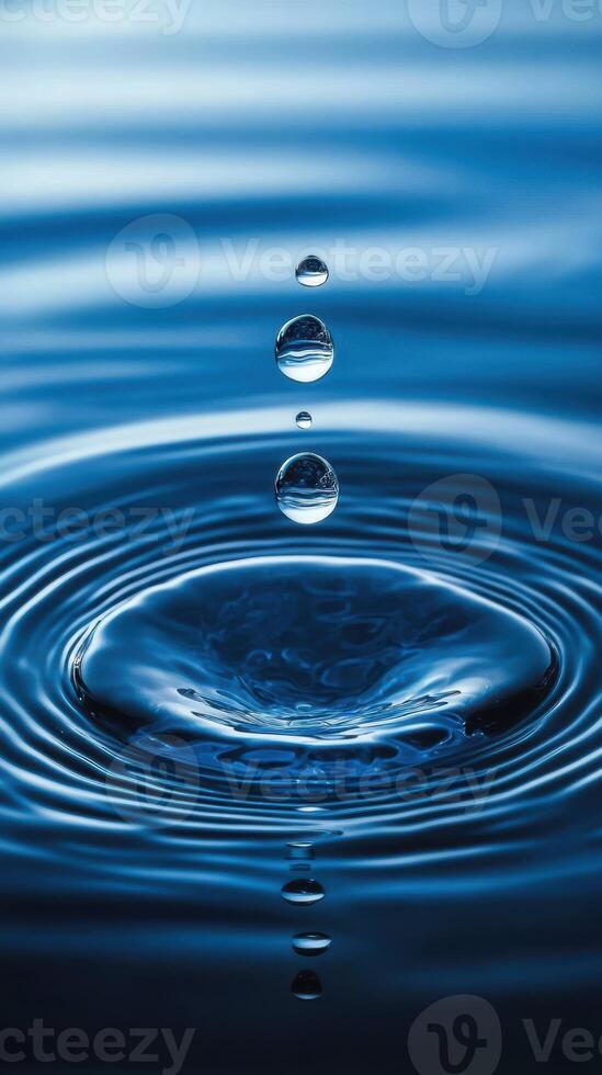 Beautiful water droplets creating ripples in a serene blue pond during daylight photo