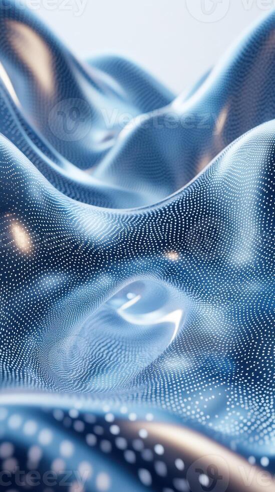 Flowing blue fabric with intricate patterns softly illuminated in gentle light photo