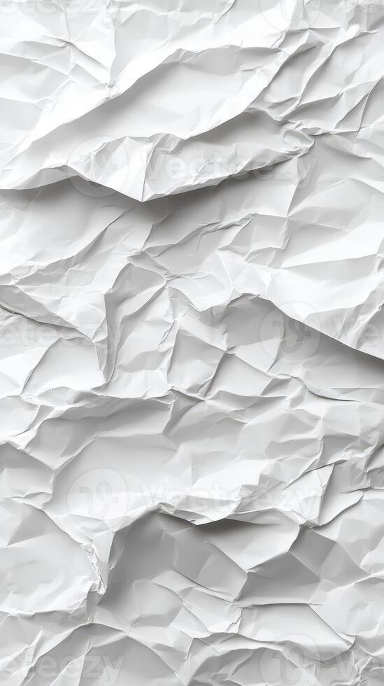 Crumpled white paper creates an abstract texture with shadows and folds in a bright lighting setting photo