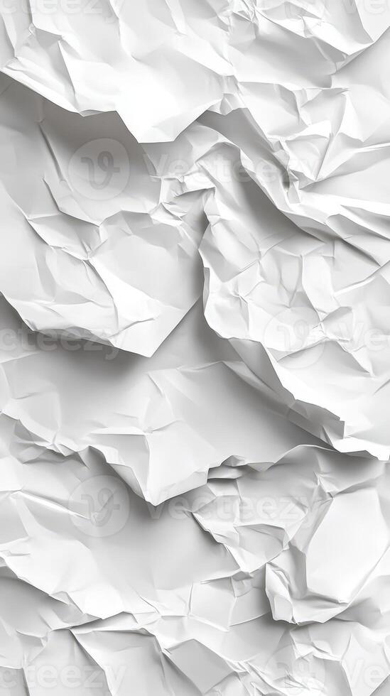 Crumpled white paper texture with varying folds and shadows in a bright setting photo