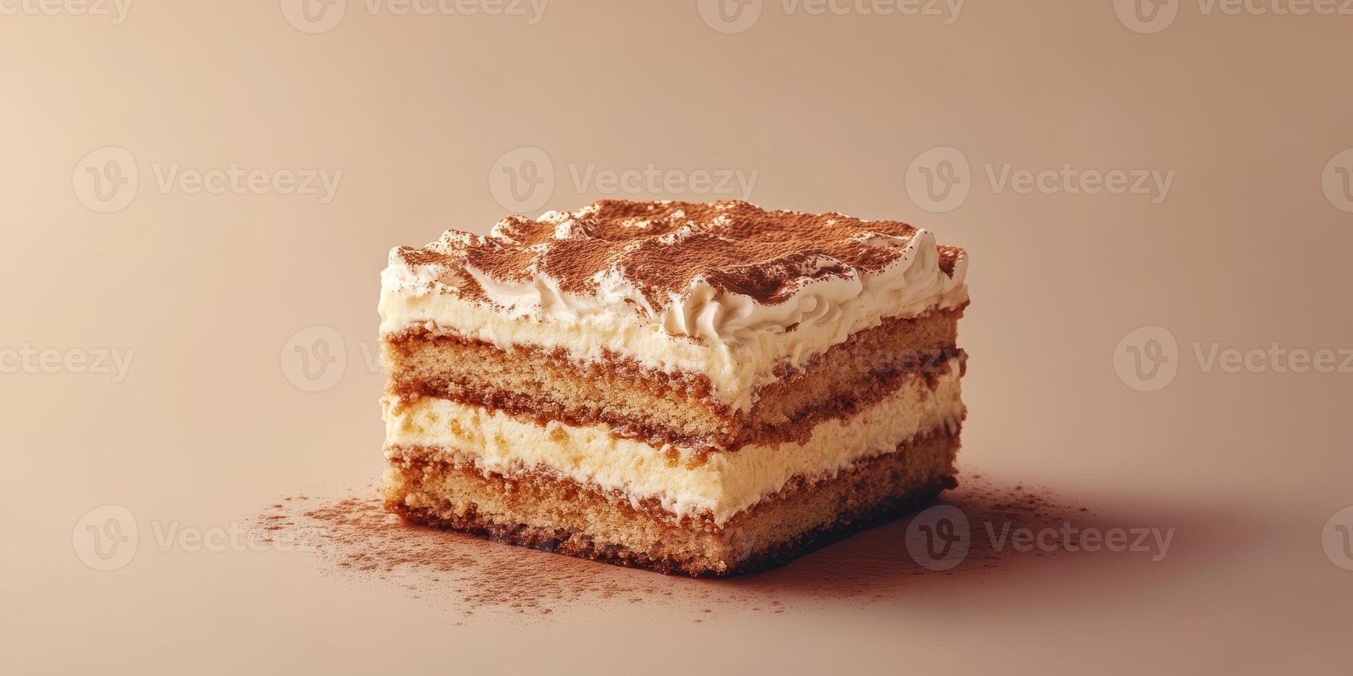 Delicious layered dessert sits on a neutral background highlighting its creamy filling and dusted cocoa photo