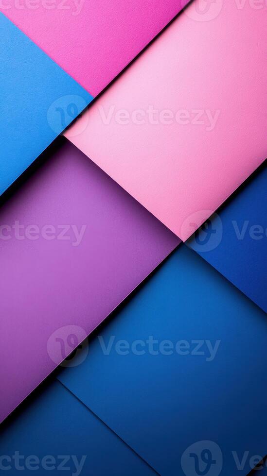 Colorful geometric paper layers arranged in a vibrant pattern showcasing shades of pink, purple, and blue photo