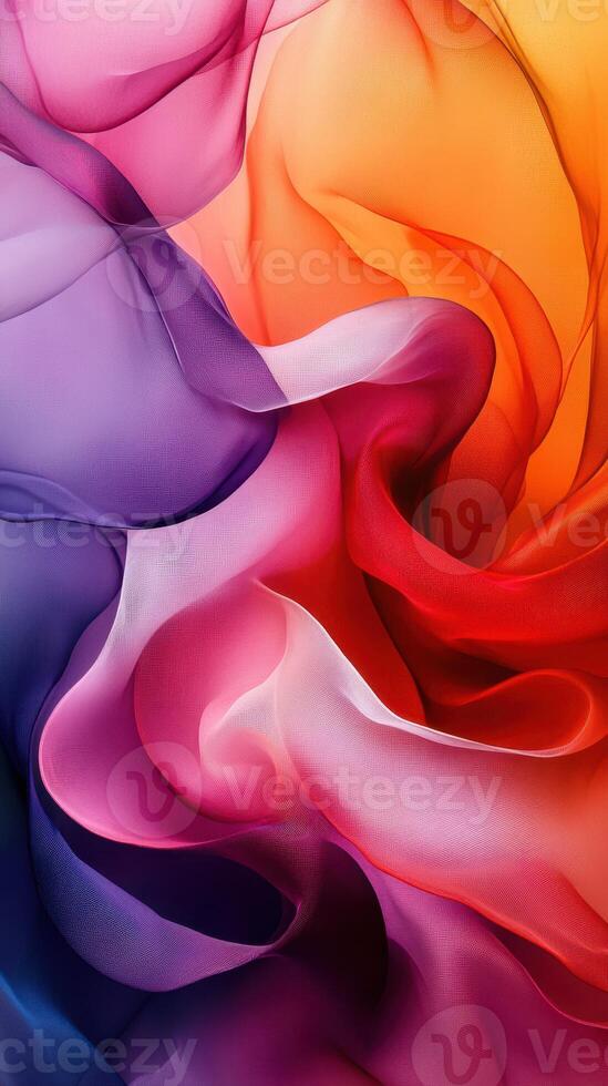 Colorful swirling fabric creating an abstract design with vibrant hues and soft textures in shades of purple, pink, orange, and red photo