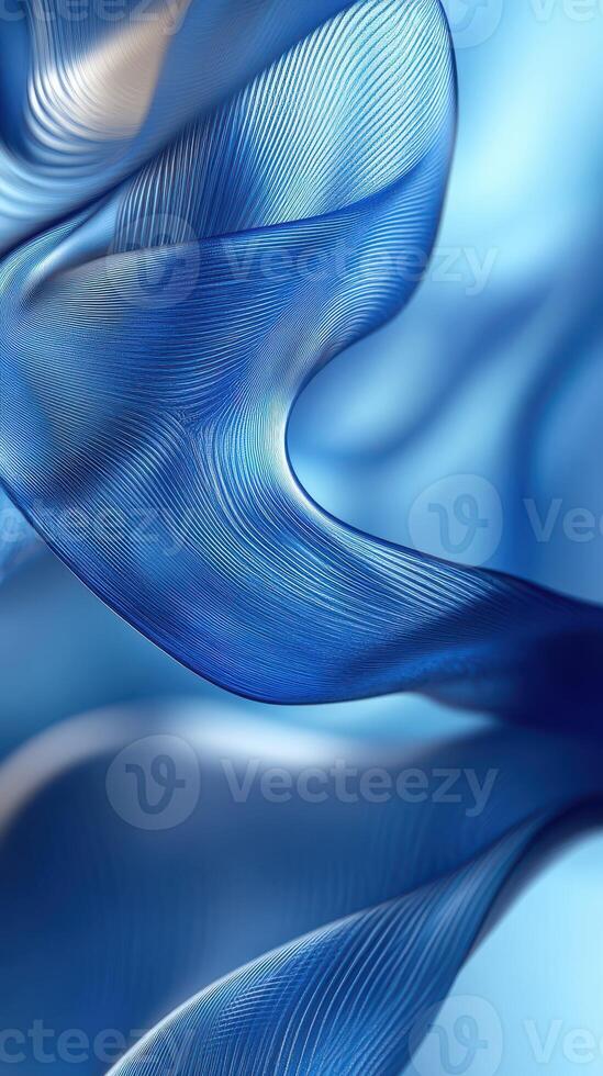 Elegant blue silk fabric gracefully flowing in a soft wave pattern under gentle light photo