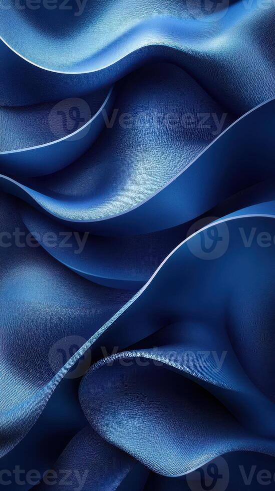 Elegant folds of deep blue fabric creating a sophisticated texture in soft waves photo