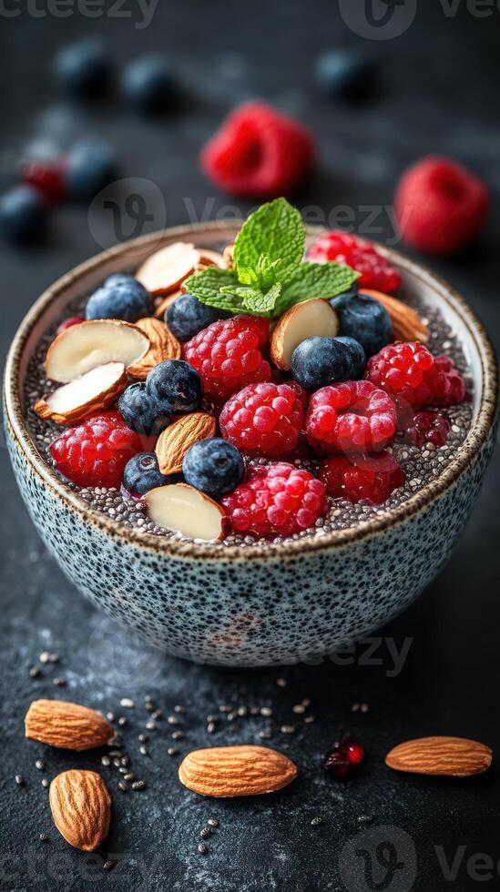 Healthy chia seed pudding topped with fresh berries and nuts ready for a nutritious breakfast or snack photo