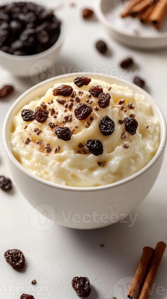 Delicious creamy rice pudding topped with chocolate shavings and raisins in a cozy kitchen setting photo