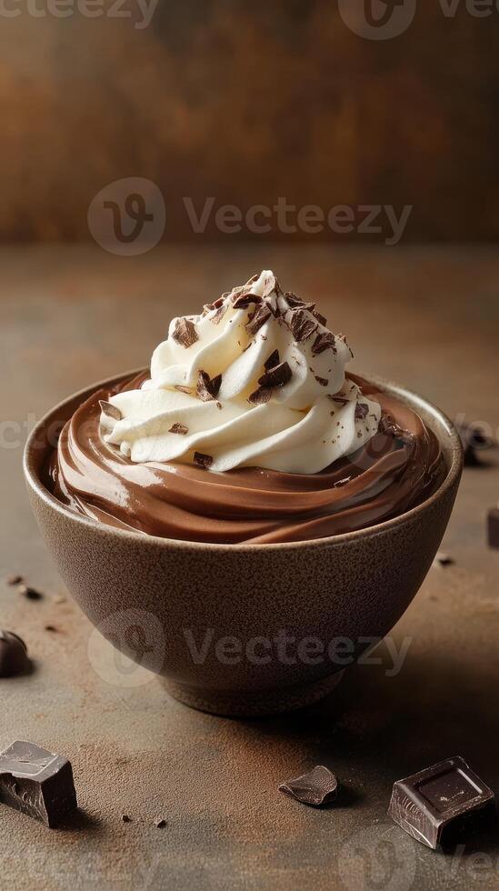 Rich chocolate dessert topped with whipped cream and chocolate shavings in a rustic bowl photo