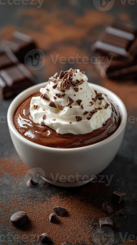 Delicious chocolate mousse topped with whipped cream and chocolate shavings in a simple bowl photo