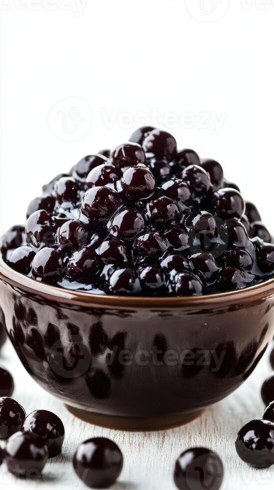 Delicious and chewy black tapioca pearls ready for desserts and drinks preparation photo
