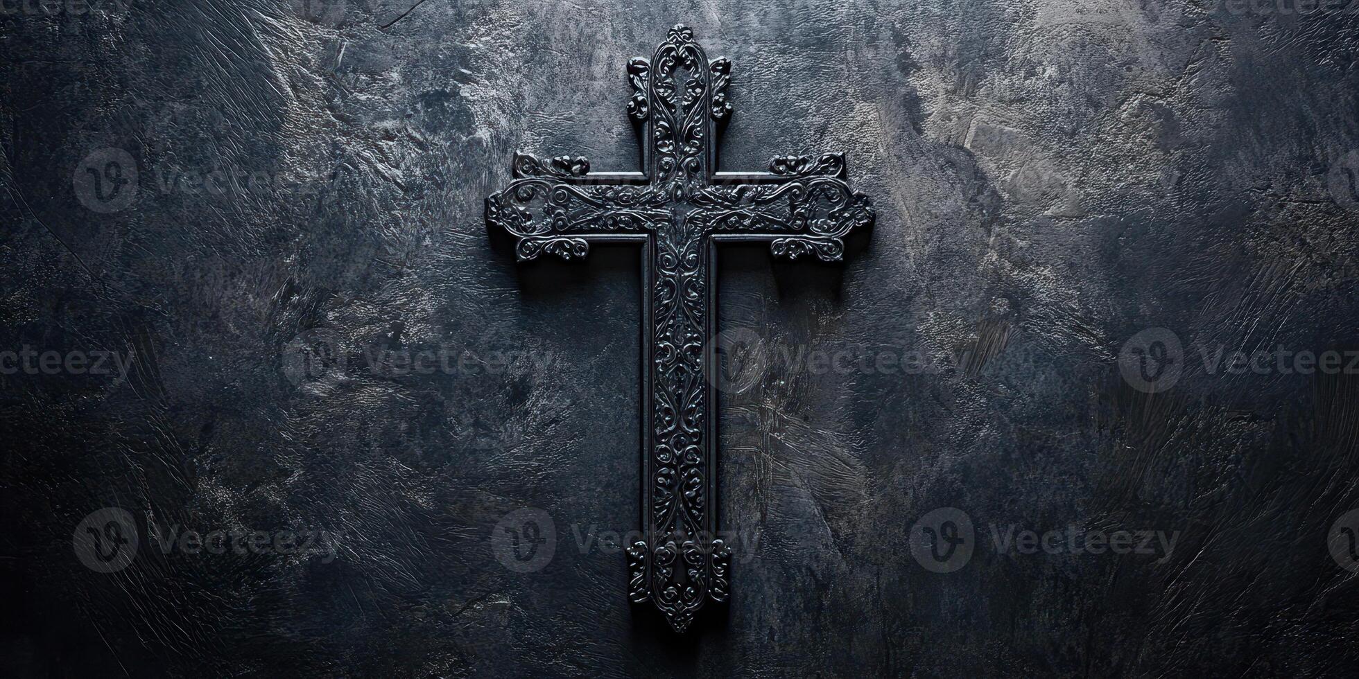Intricately designed black cross set against a textured dark background during a contemplative moment photo