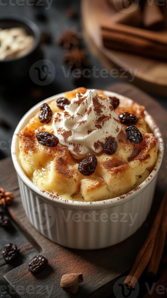 Creamy dessert topped with whipped cream and raisins served in a white ramekin on a rustic wooden table photo