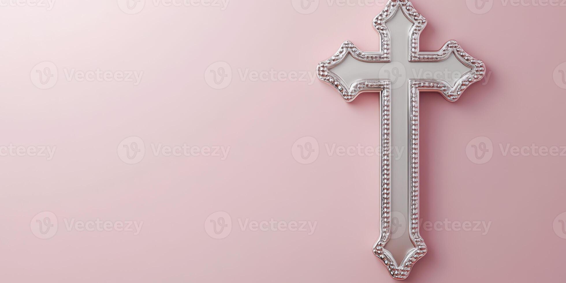 Decorative silver cross displayed on a soft pink wall for interior design and religious symbolism photo