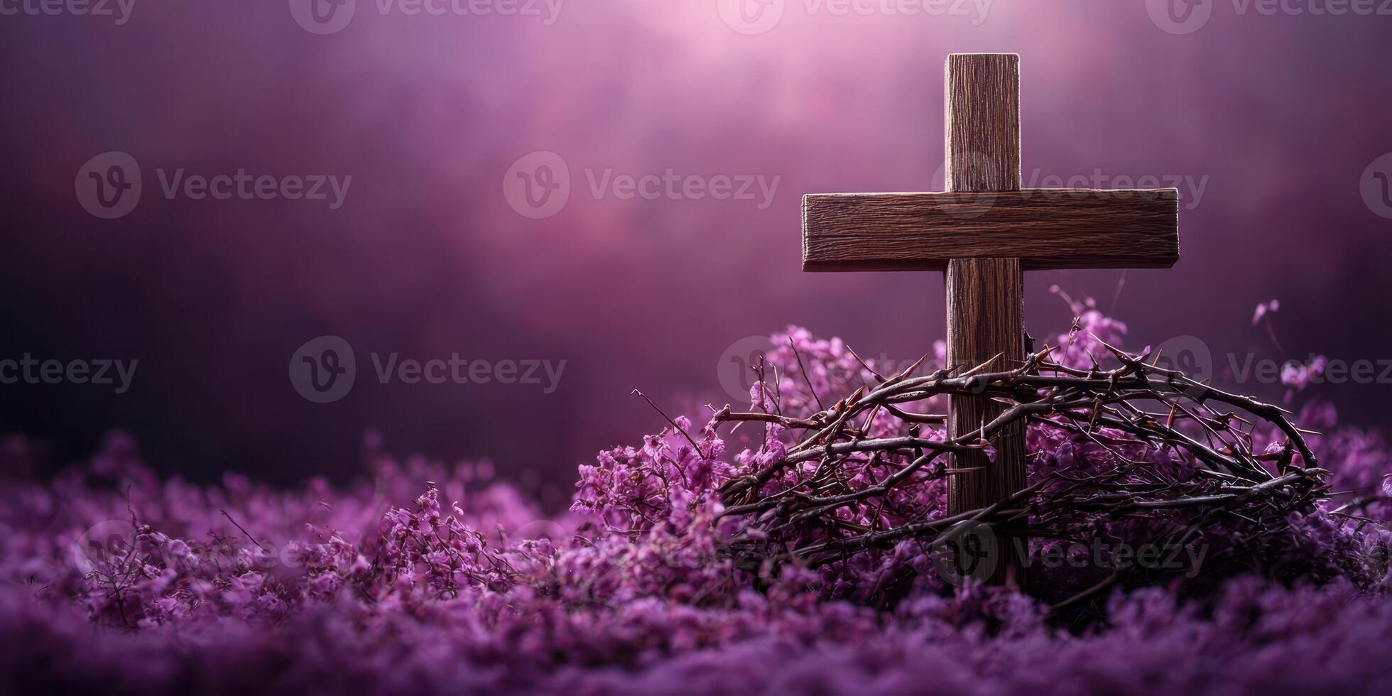 Beautiful wooden cross surrounded by purple flowers and twigs in serene setting during early evening light photo