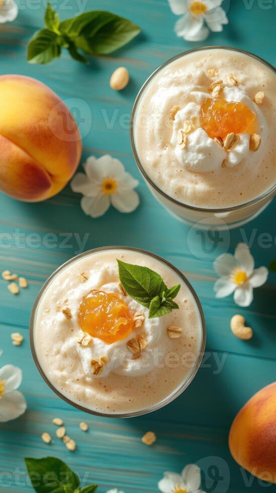 Delightful peach smoothie topped with whipped cream and garnished with fruit and nuts in a colorful setting photo