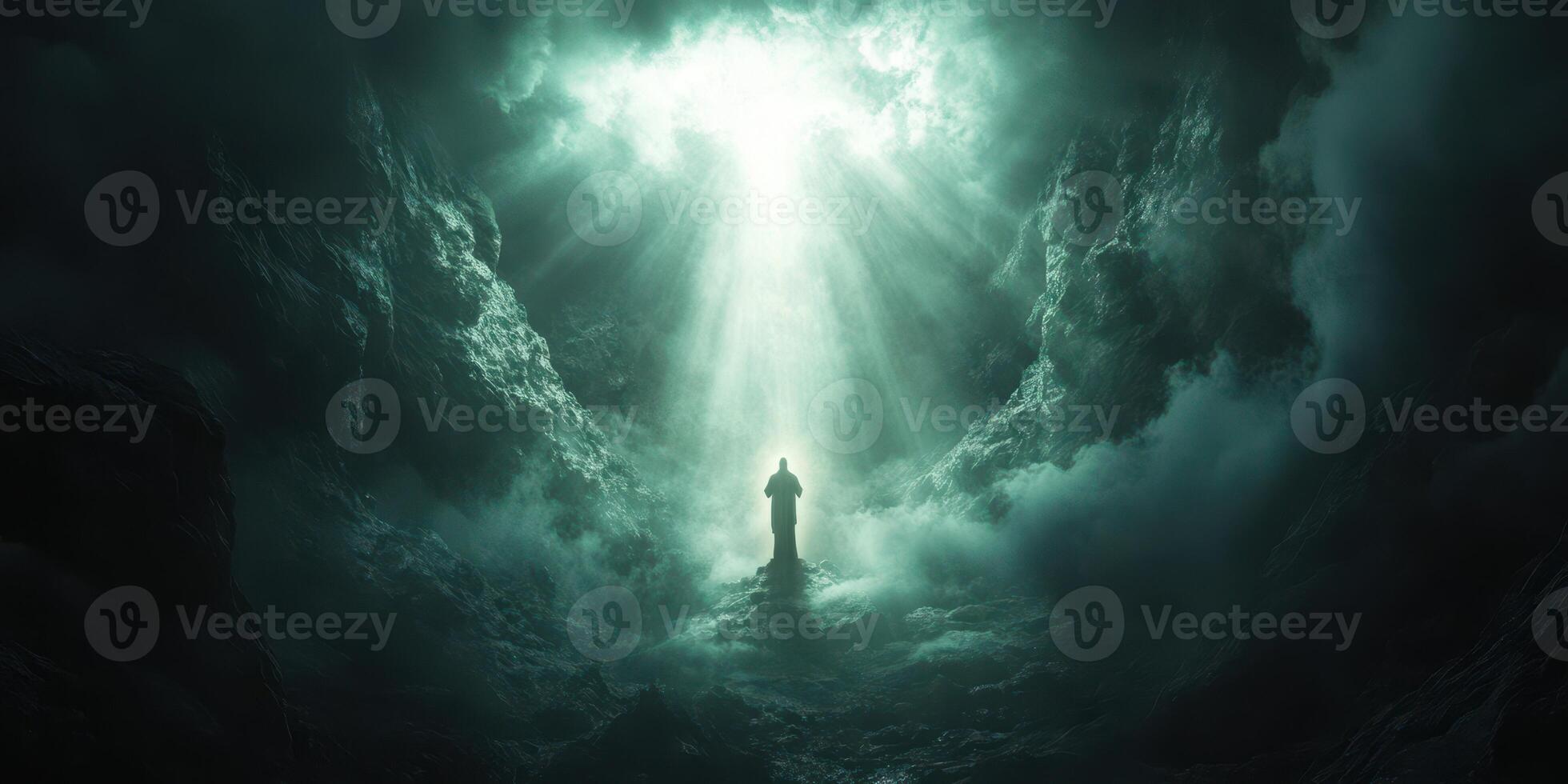 Light breaks through clouds illuminating a figure standing in a mystical atmosphere at dusk photo