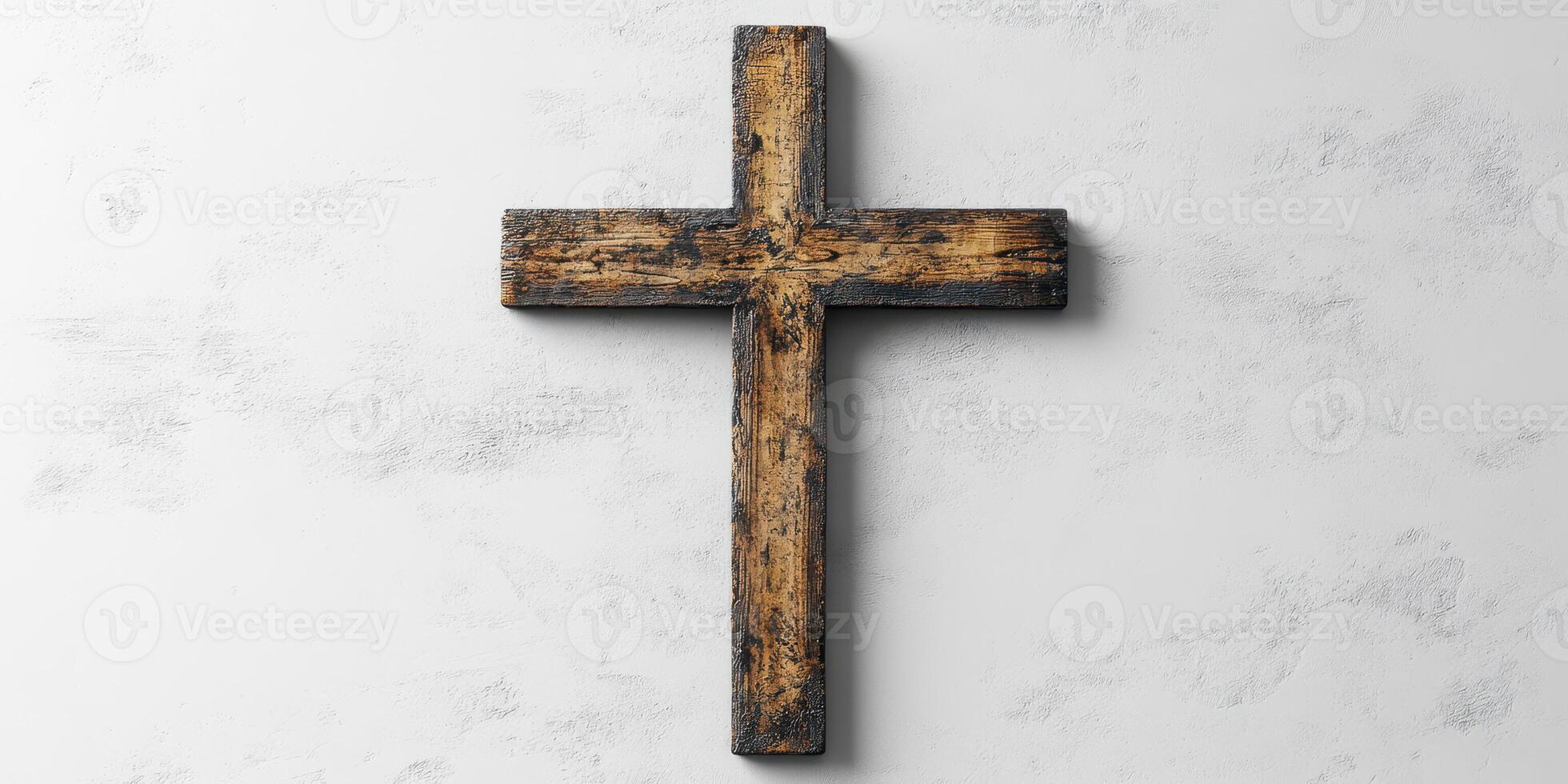 Rustic wooden cross displayed on a textured wall, symbolizing spirituality and faith in a serene environment photo