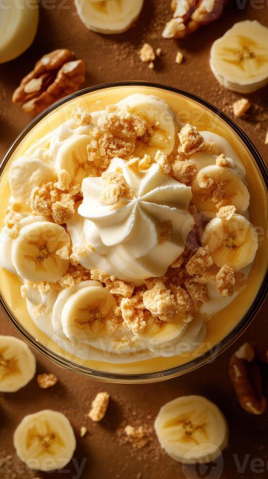 Delicious banana pudding dessert topped with whipped cream and crushed cookies at a cozy kitchen setting photo