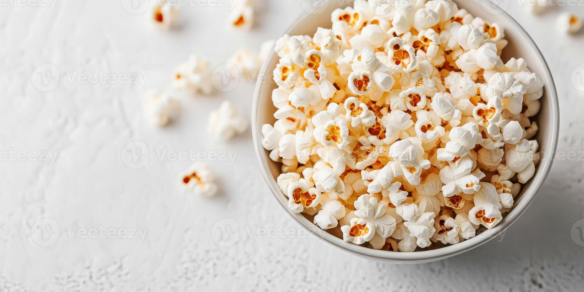 Freshly popped popcorn in a bowl ready for movie night or snack time with friends and family photo