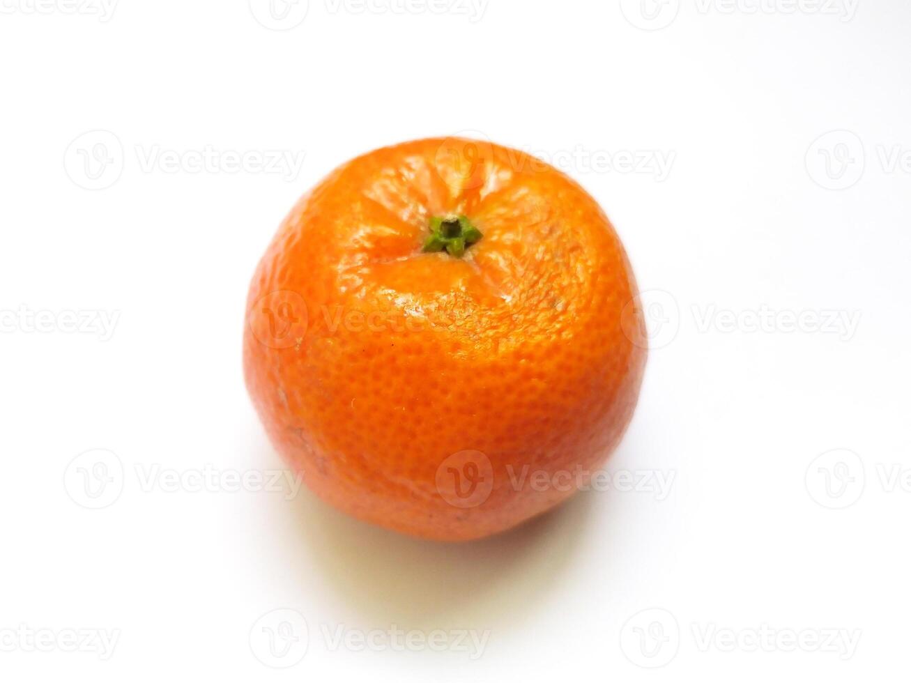 A vibrant, juicy mandarin orange sits on a stark white background. photo