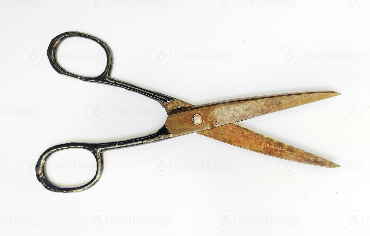 Rustic, vintage scissors isolated on white. A timeless tool, symbolizing cutting ties, making choices, or the passage of time. Ideal for concepts of nostalgia, craftsmanship, or DIY projects. photo