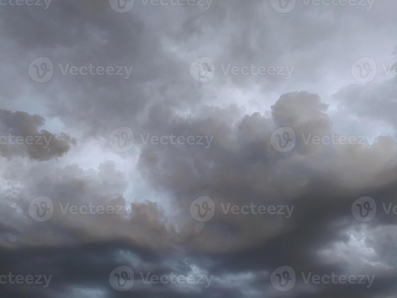Dramatic cloud fomation fills the sky during an overcast evening, hinting at an approaching storm photo