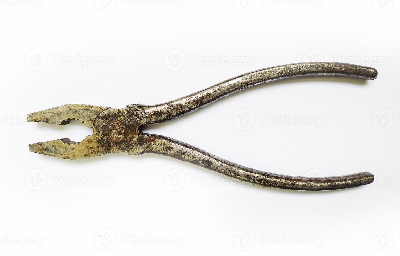 Rustic, aged pliers isolated on white. Shows wear and tear, suggesting a history of hard work. Perfect for concepts of craftsmanship, resilience, or the passage of time. photo