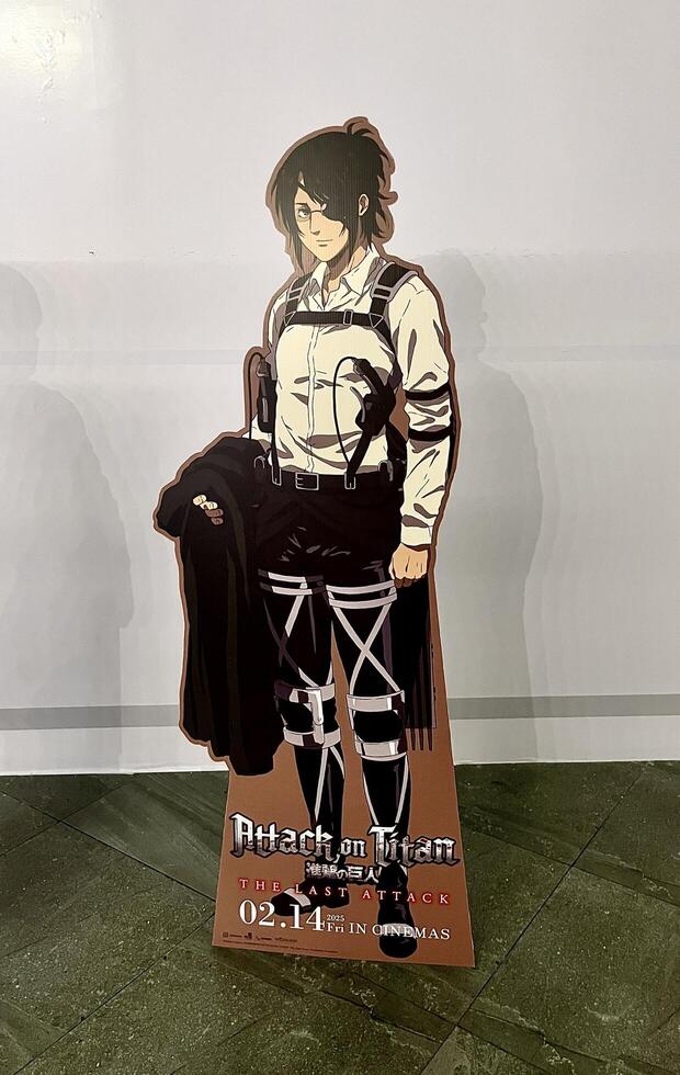 Jakarta, Indonesia - February 17th, 2025 - Attack on Titan the last attack anime movie Hans or Hanji standee cut out cardboard display on vertical indoor environment background. photo