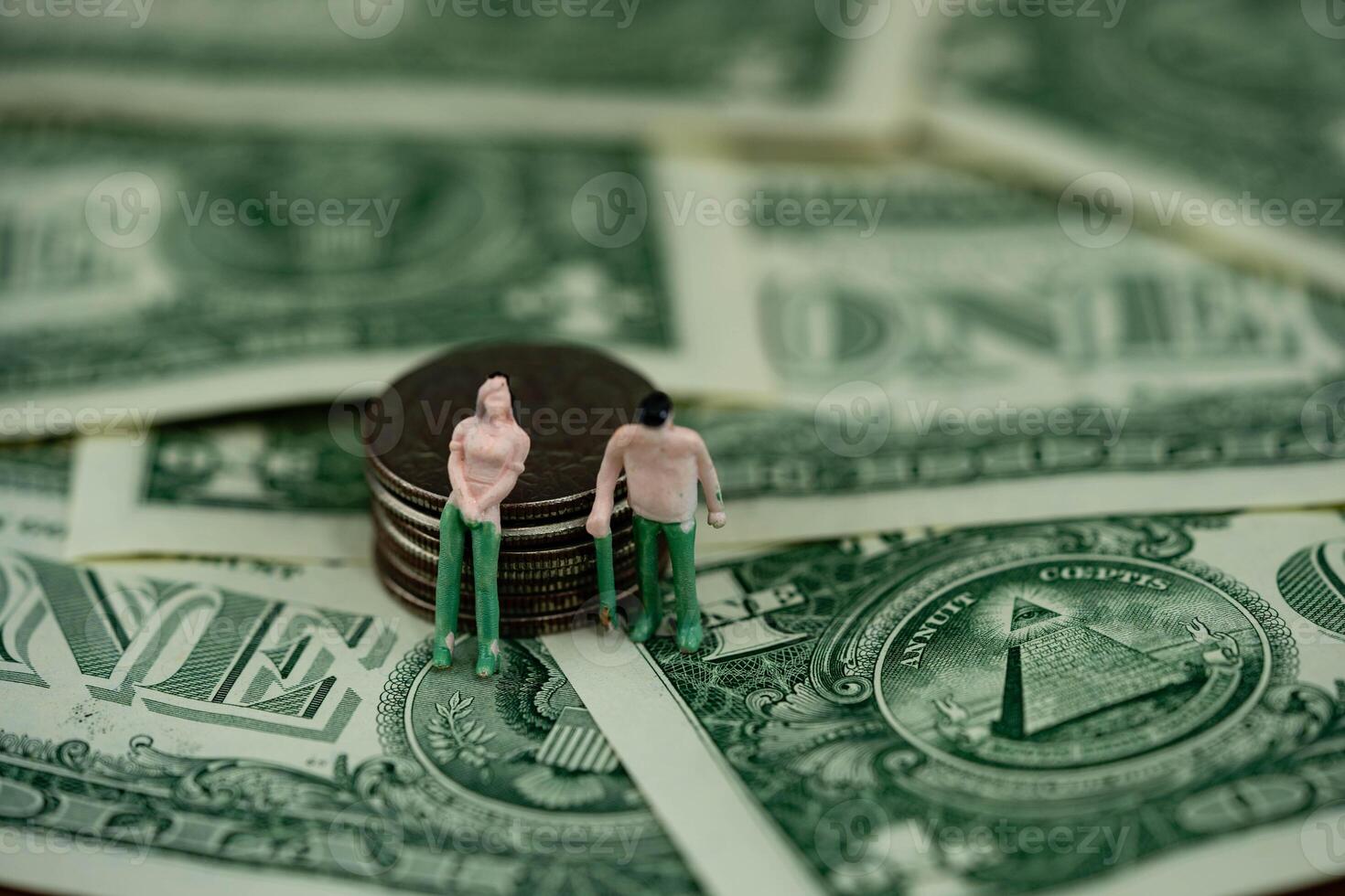 two figures with US money photo