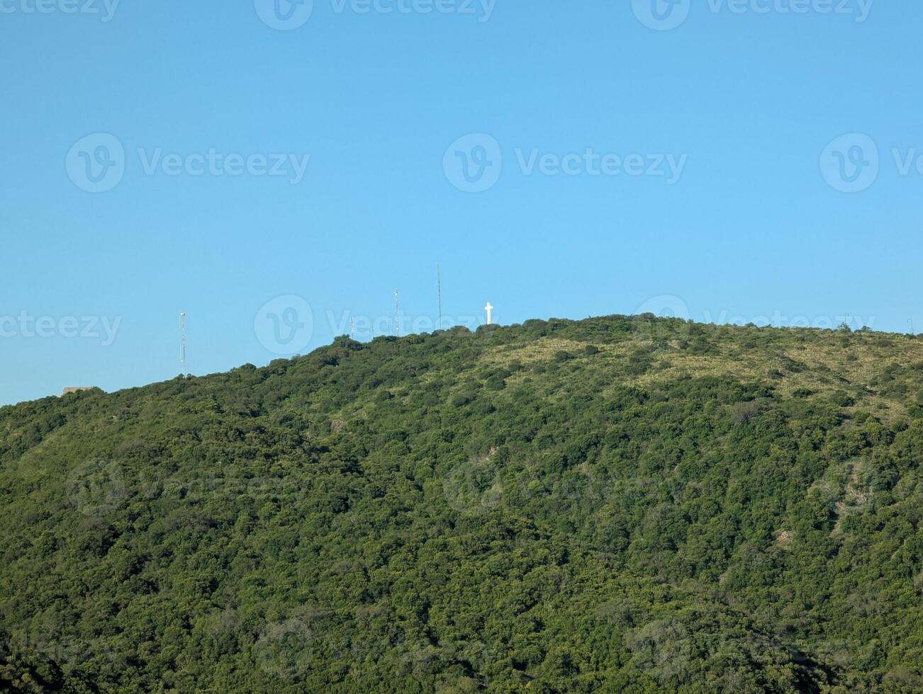 Mountains near the city of Villa Carlos Paz in central Argentina. White cross on top photo