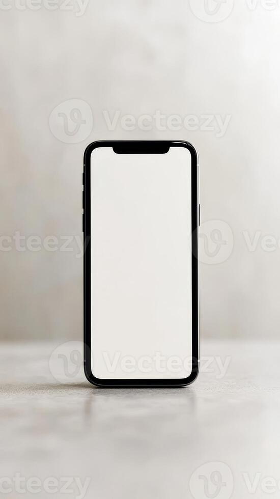 Blank smartphone standing on a modern table against a neutral background, showcasing minimalist design and elegance photo
