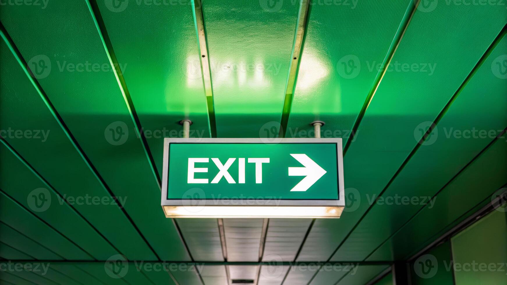 Green exit sign with cyan overlay indoor location illustration of safety direction modern environment straight viewpoint photo