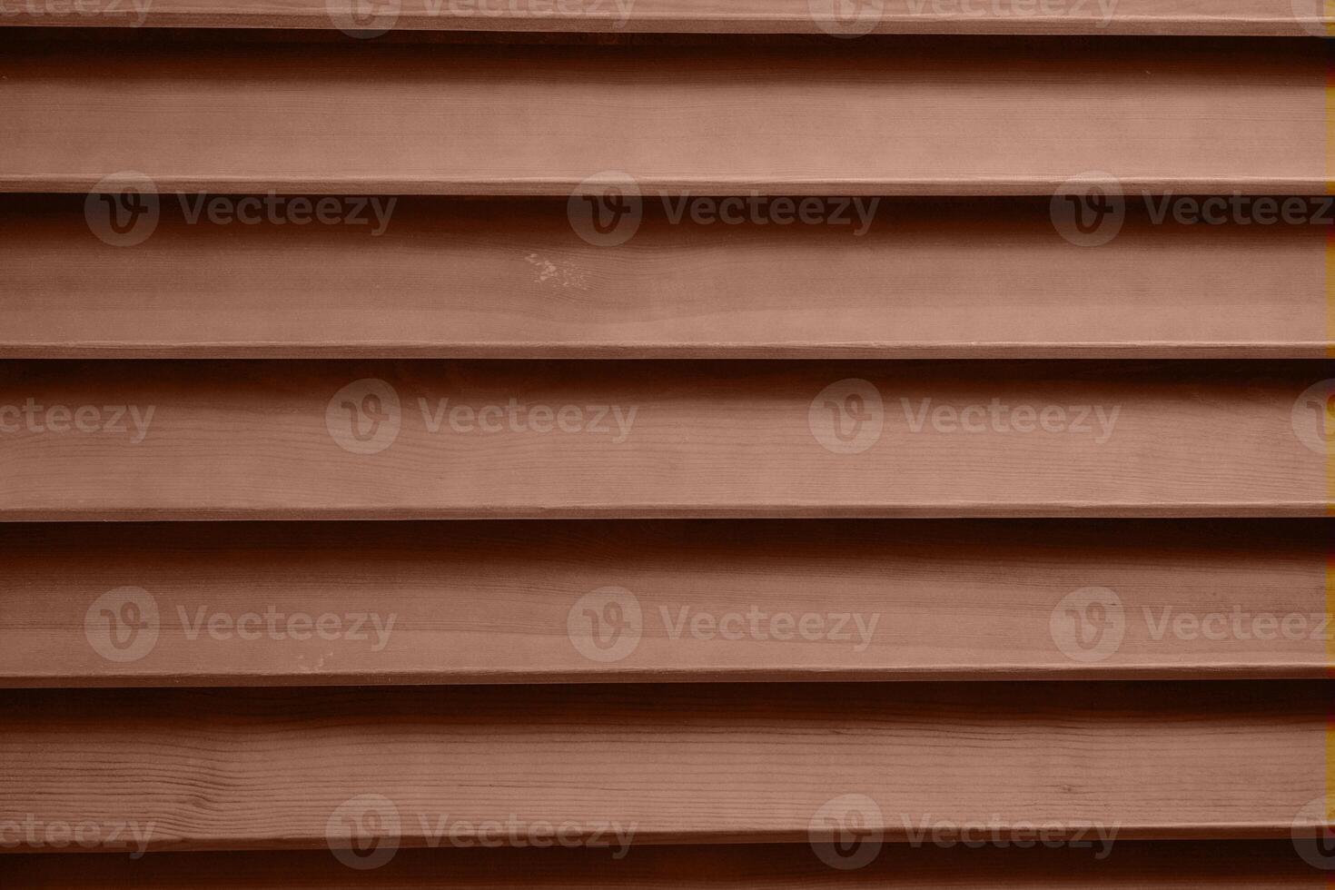 Color of the year 2025 Mocha Mousse. Old grunge dark textured wooden background with holes. The surface of the brown texture of wooden blinds photo